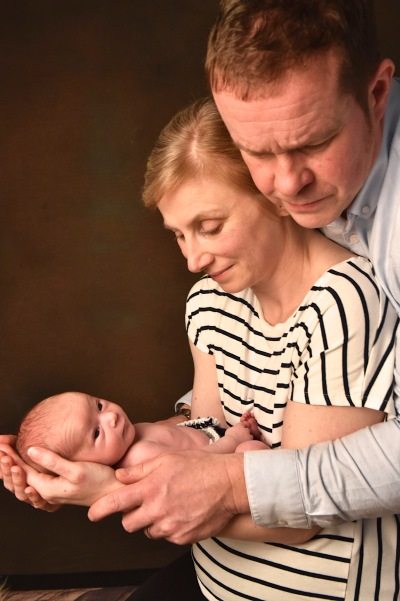 portrait photographer derby - Derby Couple portrait holding newborn baby