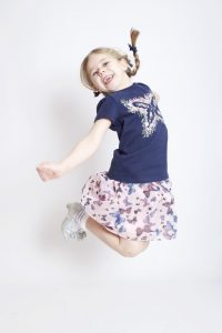 Young girl jumping fun portrait by the family portrait photographer in Derby - AF1