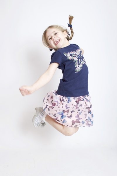 Young girl jumping fun portrait by the family portrait photographer in Derby - AF1